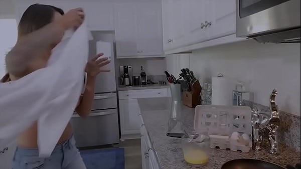 Topless MILF blows and fucks her stepson while she cooks